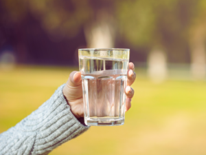 Woman testing quality of her water to determine source of rotten egg smells 